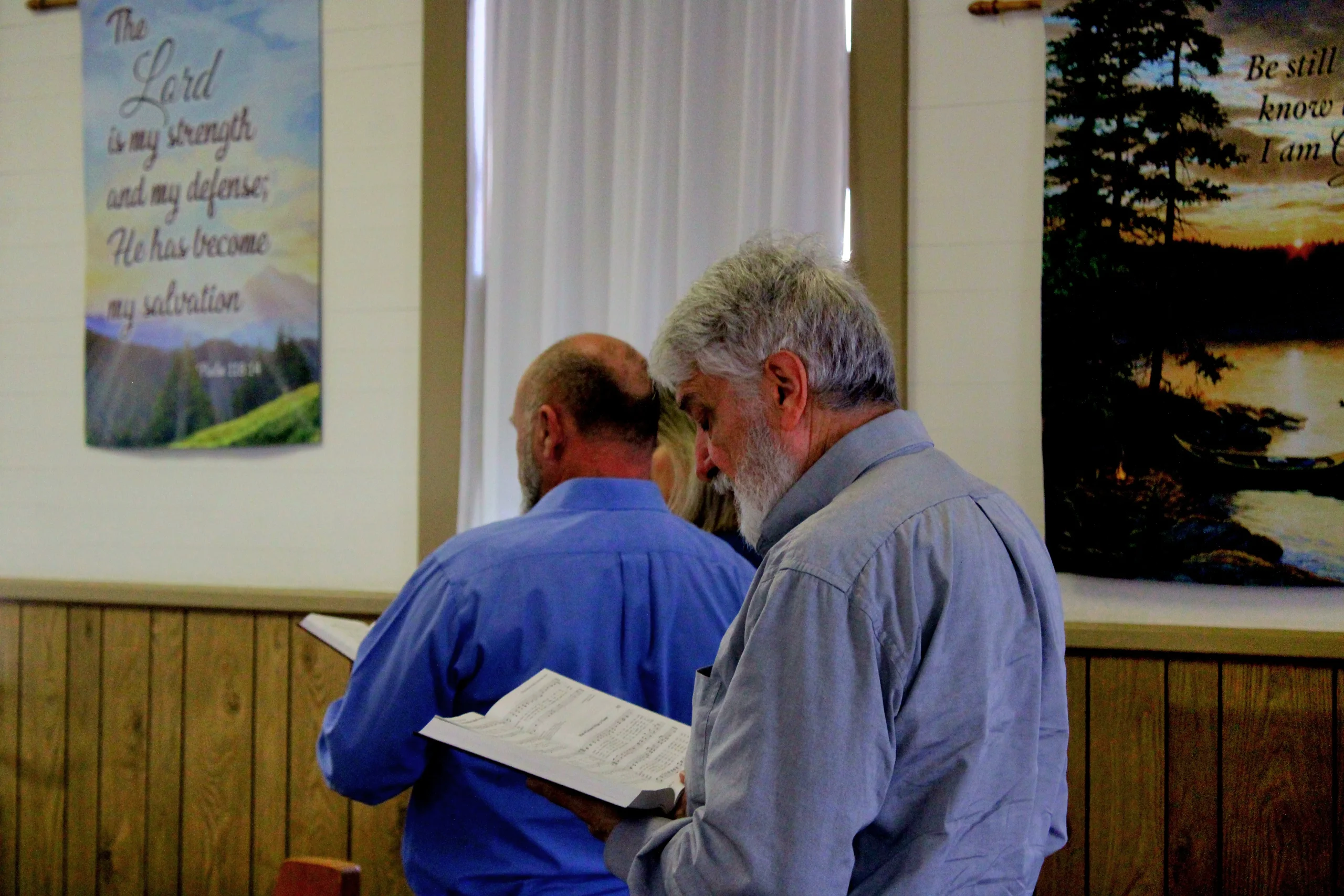 person standing while reading ook