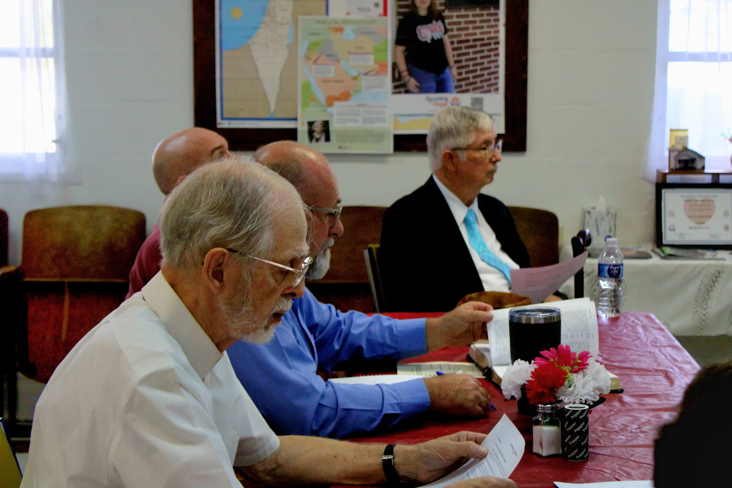 boy in blue shirt screaming near boy in green crew-neck shirt